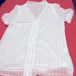 Lovely white lace v neck pulling blouse.  Never worn